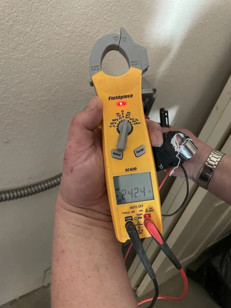 Voltage testing with clamp meter during Hot Tub / Pool Electrical Wiring in Groton